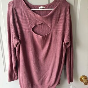 Stretchy knit top with peek-a-boo detail at front.